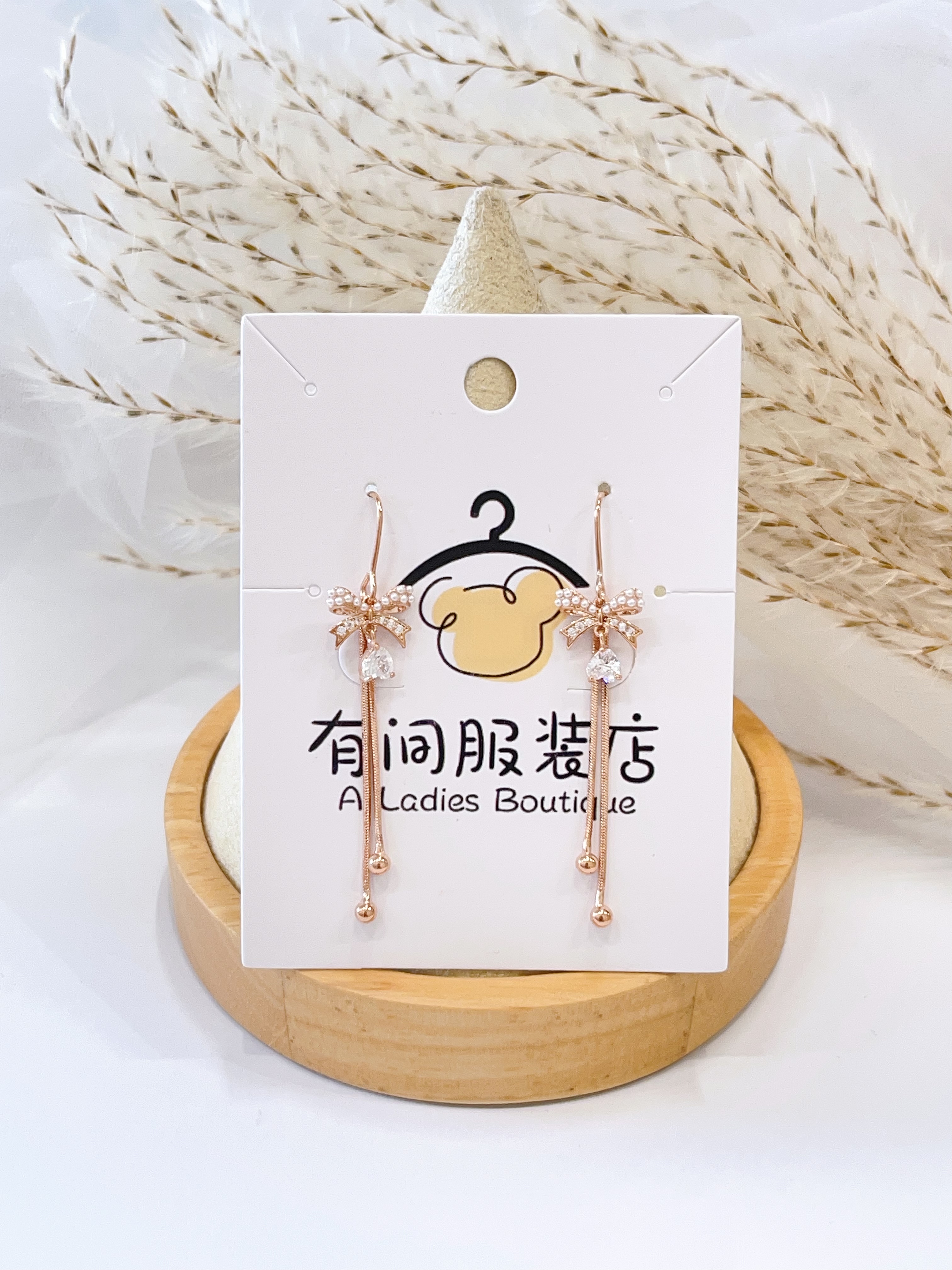 玫瑰金蝴蝶结双流苏耳环