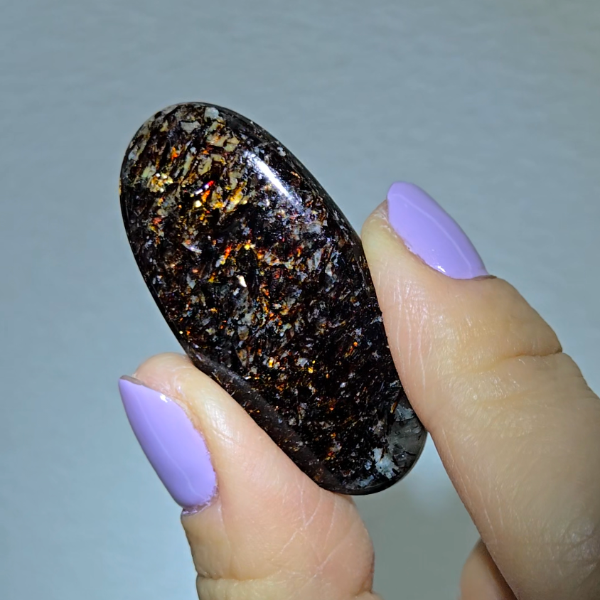 Astrophyllite cabochon with red, golden, bronze inclusions - AST25 