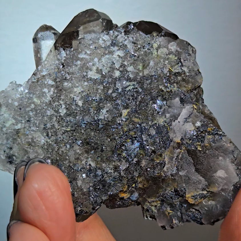 Golden starburst rutiles in quartz on black hematite - RT1444
