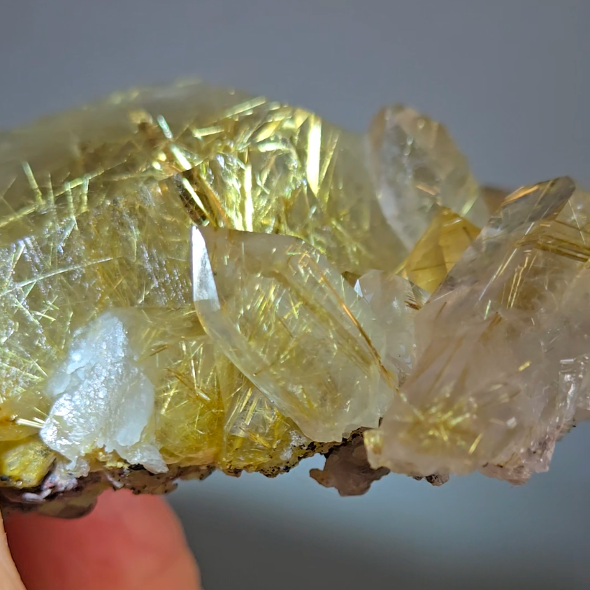 Golden titanium rutiles on black hematite in quartz cluster - RT1443