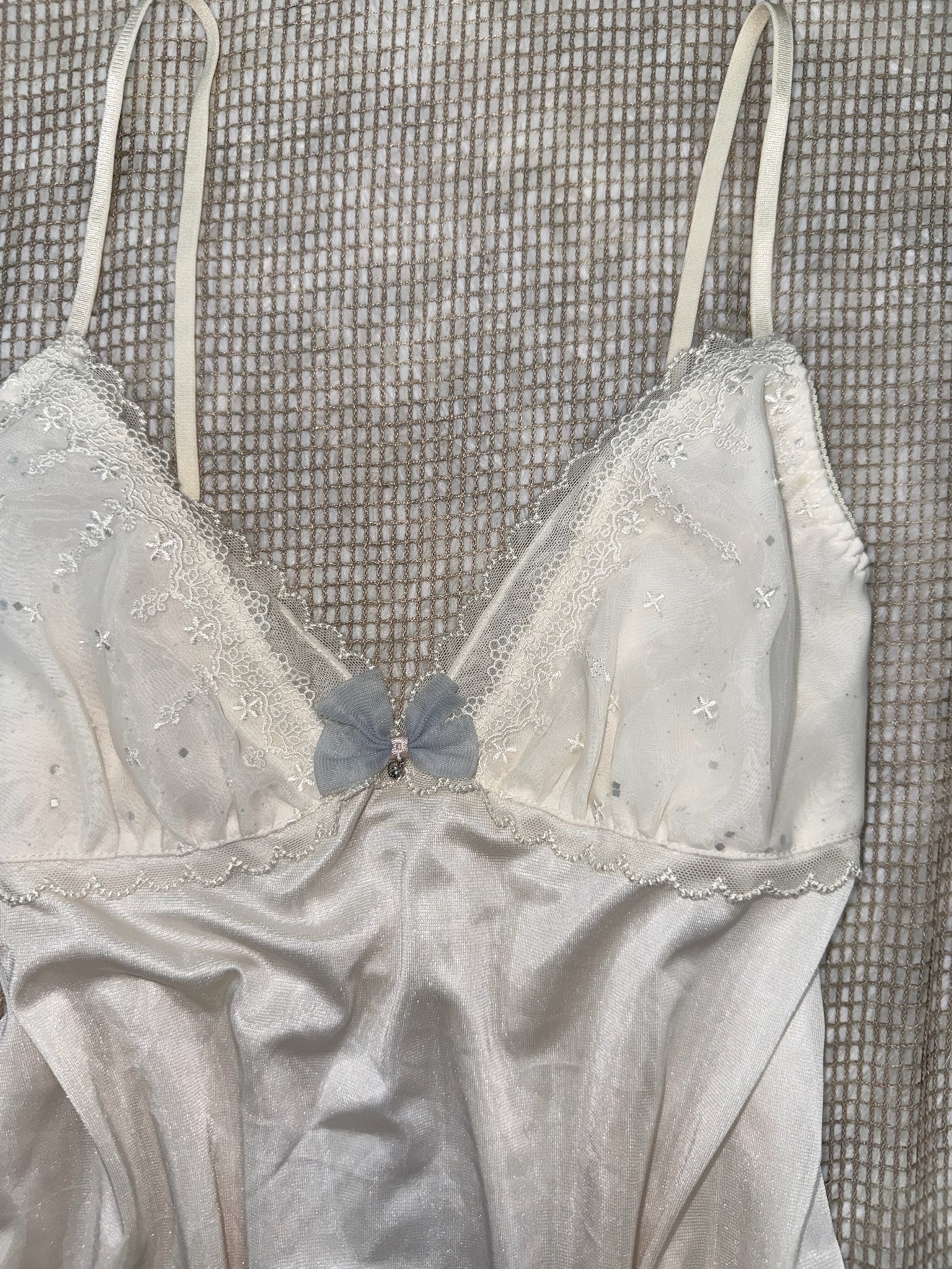 White Satin Camisole Top with Lace Embroidery and Blue Bow Detail