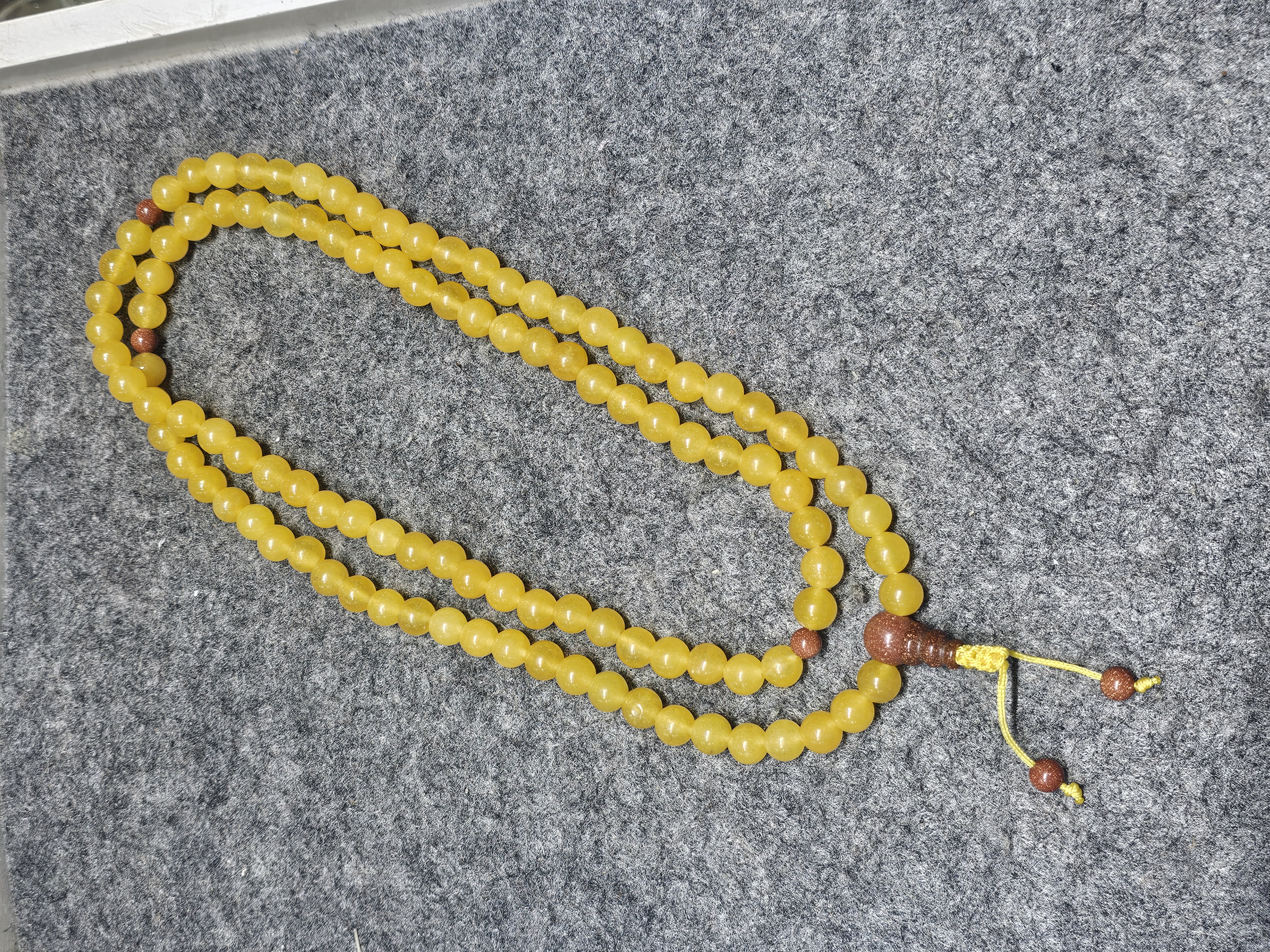 黃玉8mm金沙石佛頭 108粒念珠