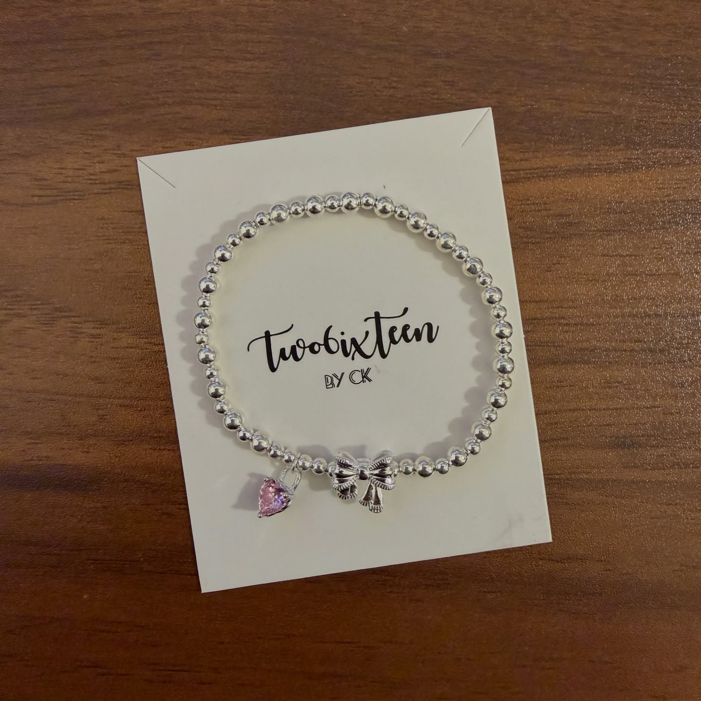 APB001 圓珠彈性手鏈拼蝴蝶結心型石