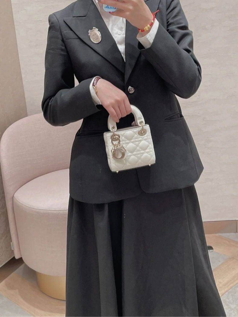 Elegant Women's Black Suit with White Mini Handbag