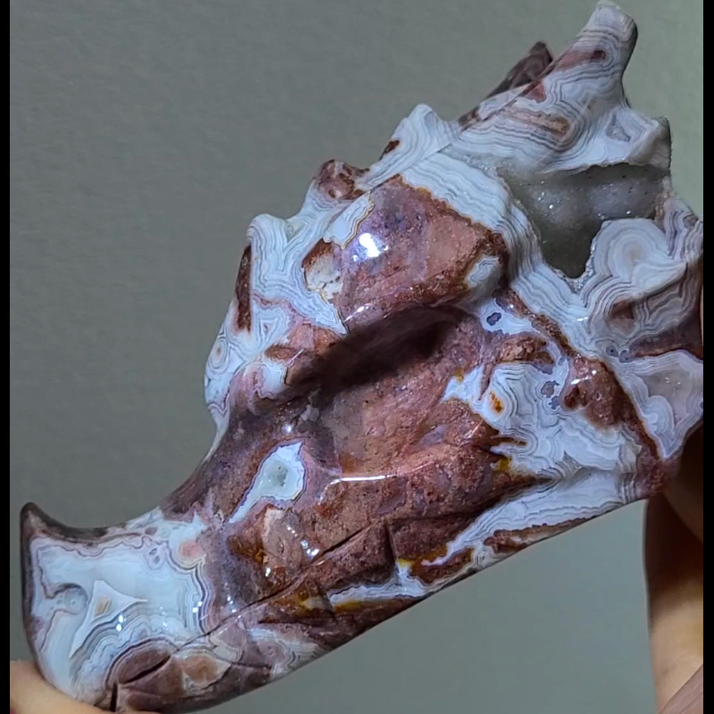 Mexican red agate carved into a dragon skull.