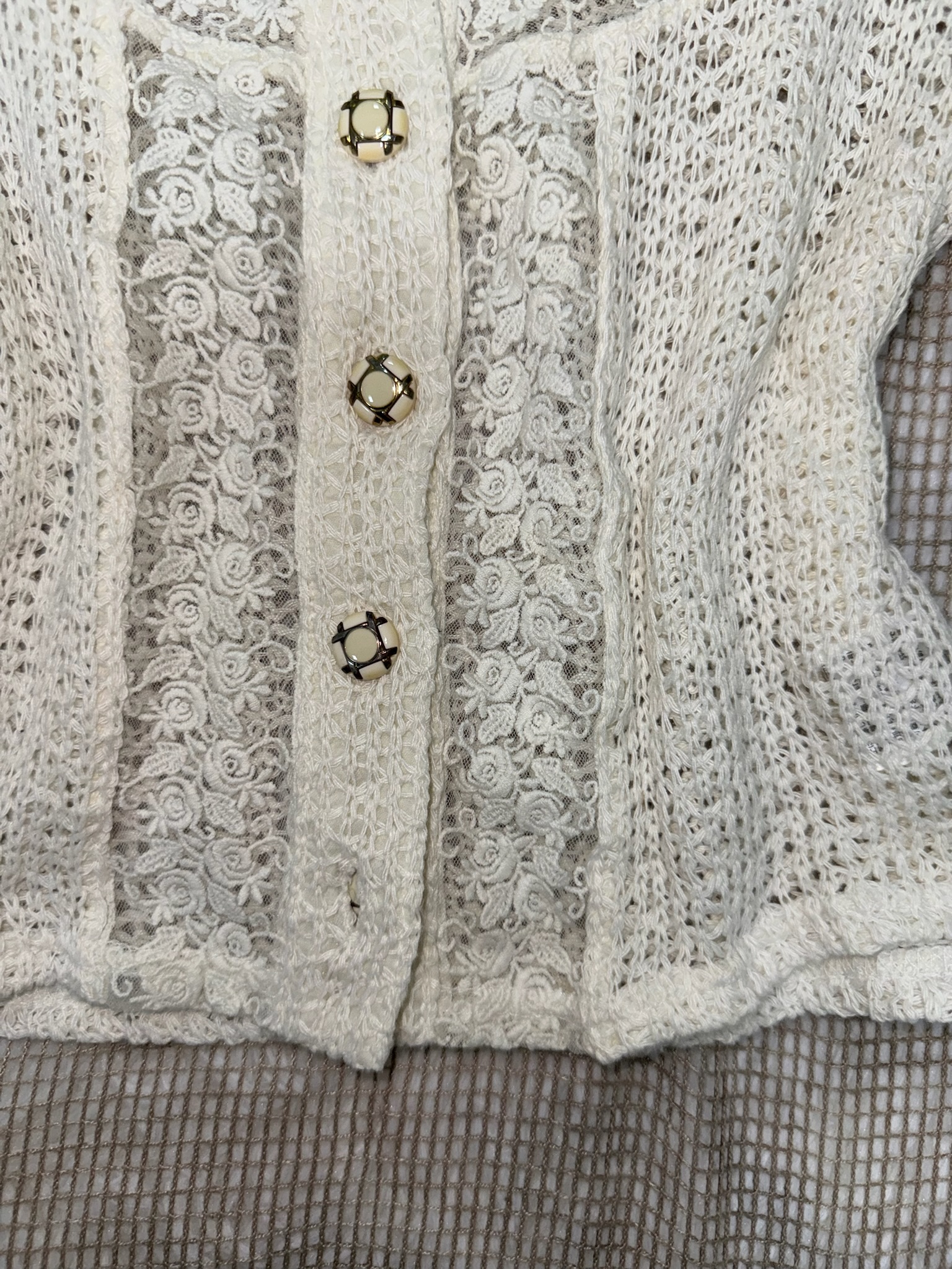Cream Short-Sleeve Crochet Lace Blouse with Ornate Buttons and Floral Trim