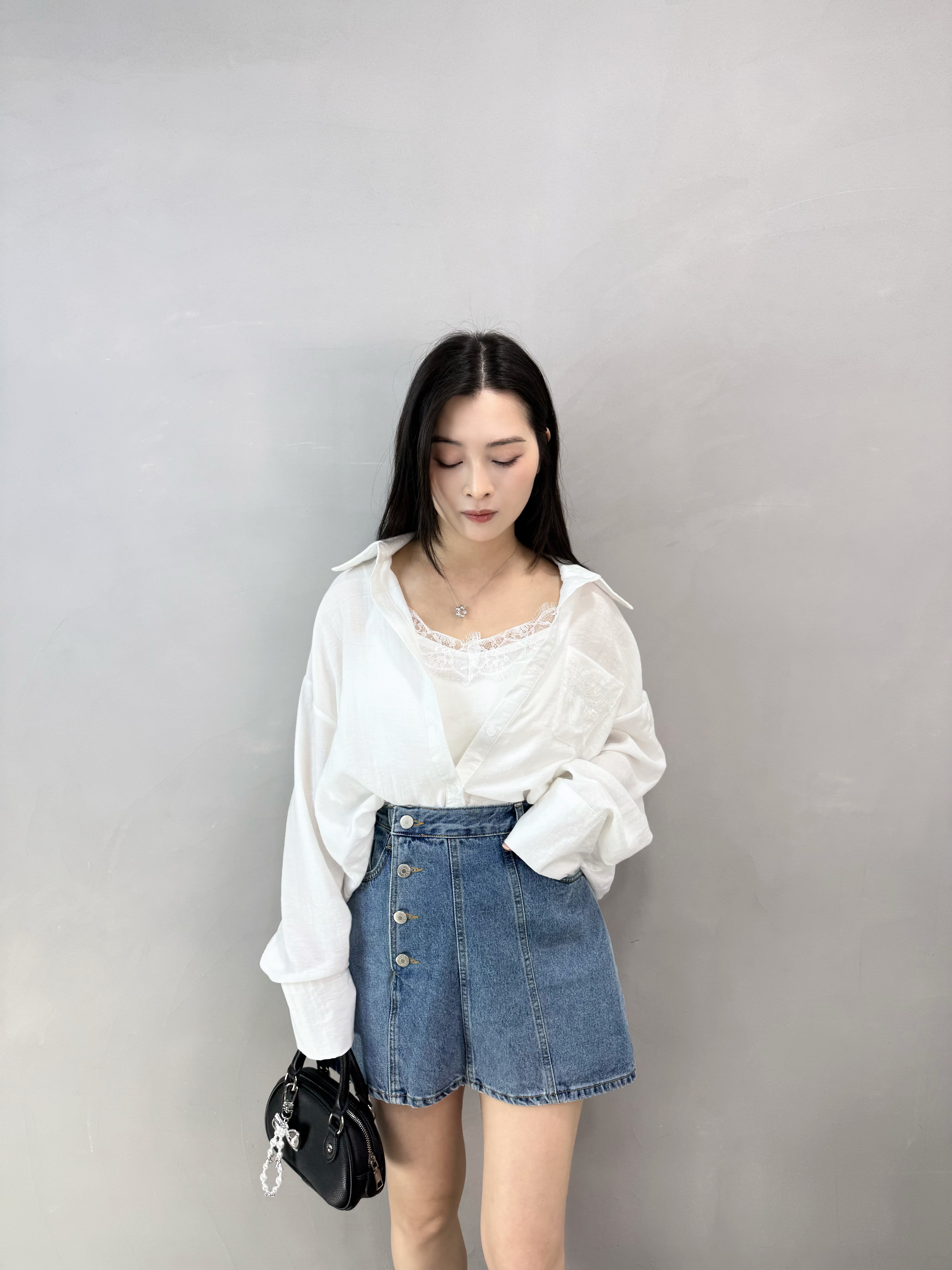 I75 側扣車骨牛仔裙褲