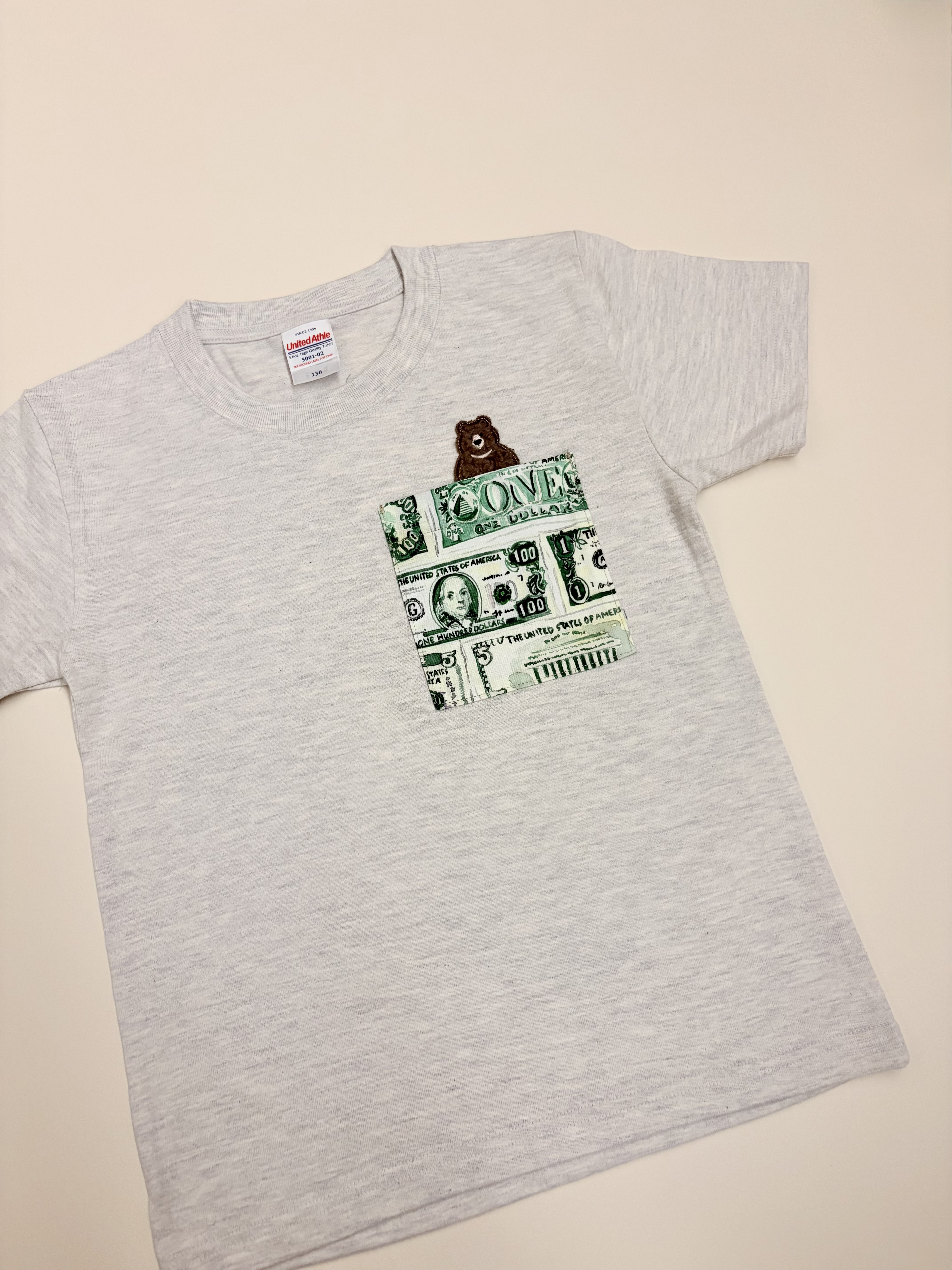 美元與小熊口袋T-Shirt（130碼）