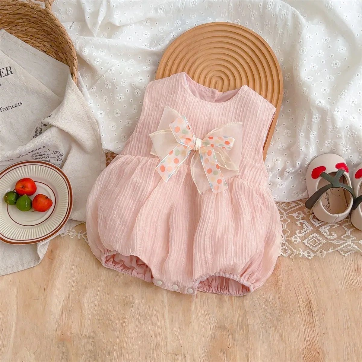 561316 | Charming Baby Girl Sleeveless Bubble Romper with Bow Accent