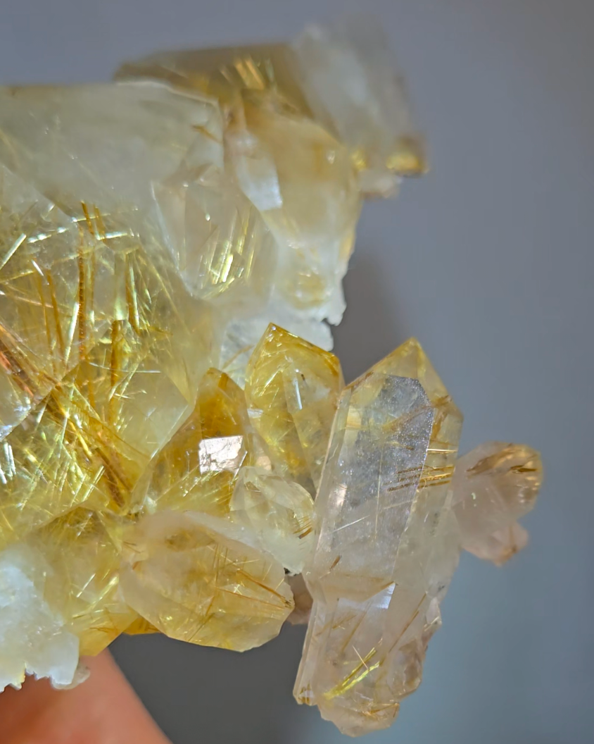 Golden titanium rutiles on black hematite in quartz cluster - RT1443