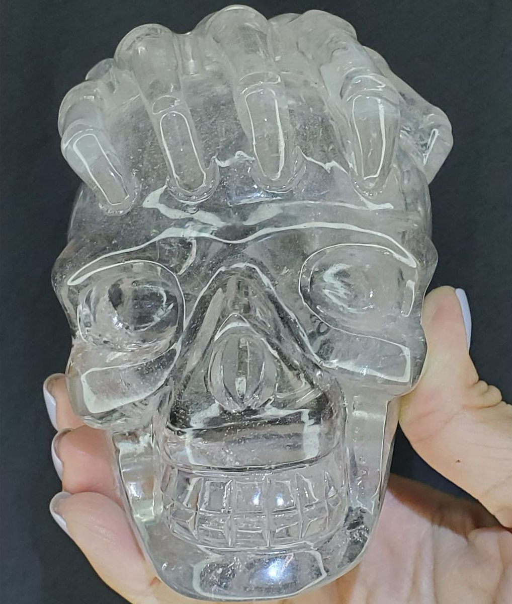 Clear quartz skull and skeleton hand with massive rainbows everywhere.