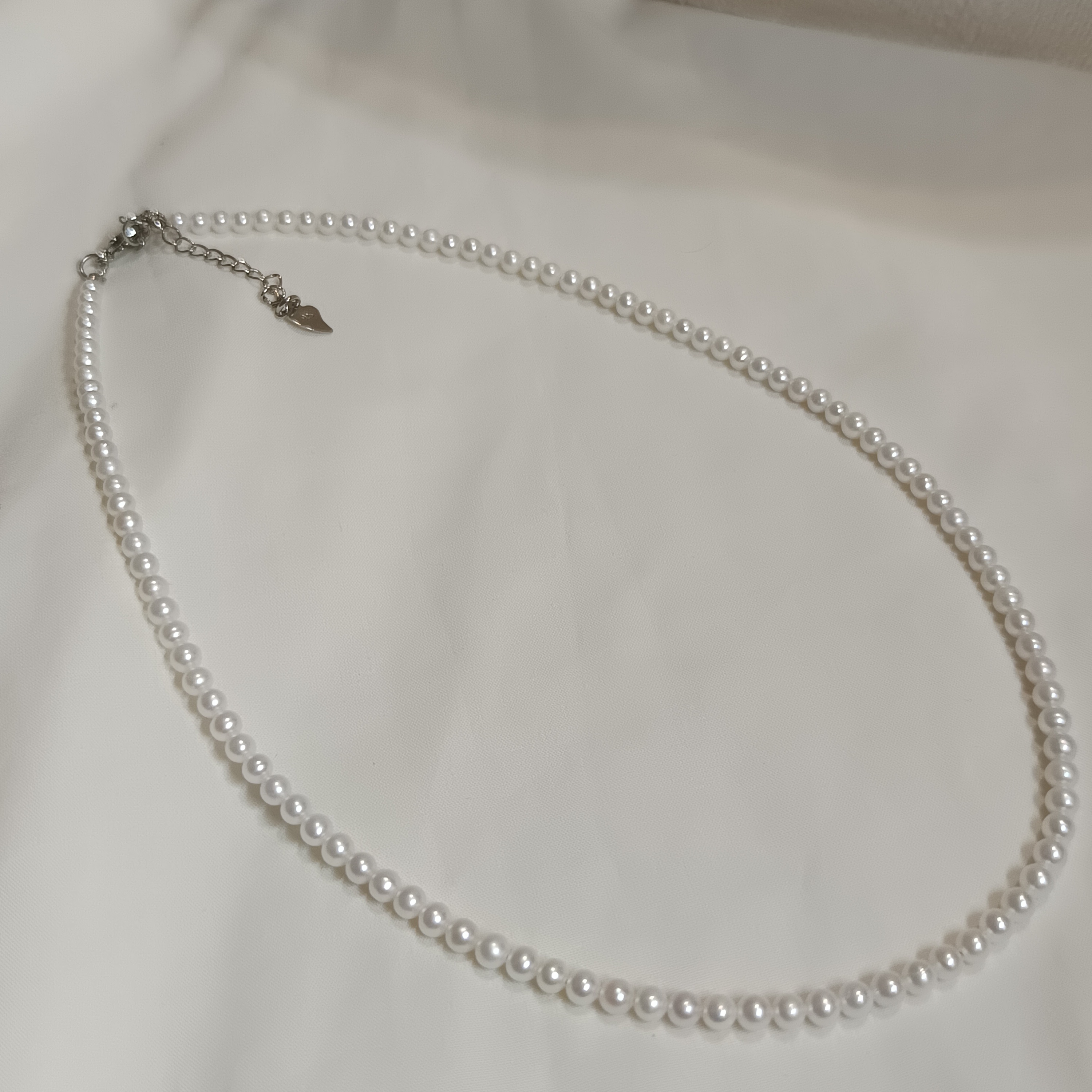 近正圓強光淡水AK白細胞baby珍珠注白金愛心尾鍊扣時尚鎖骨鍊