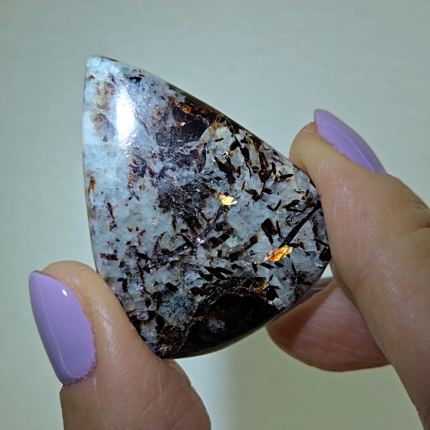 Astrophyllite cabochon with flashy golden flakes - AST21