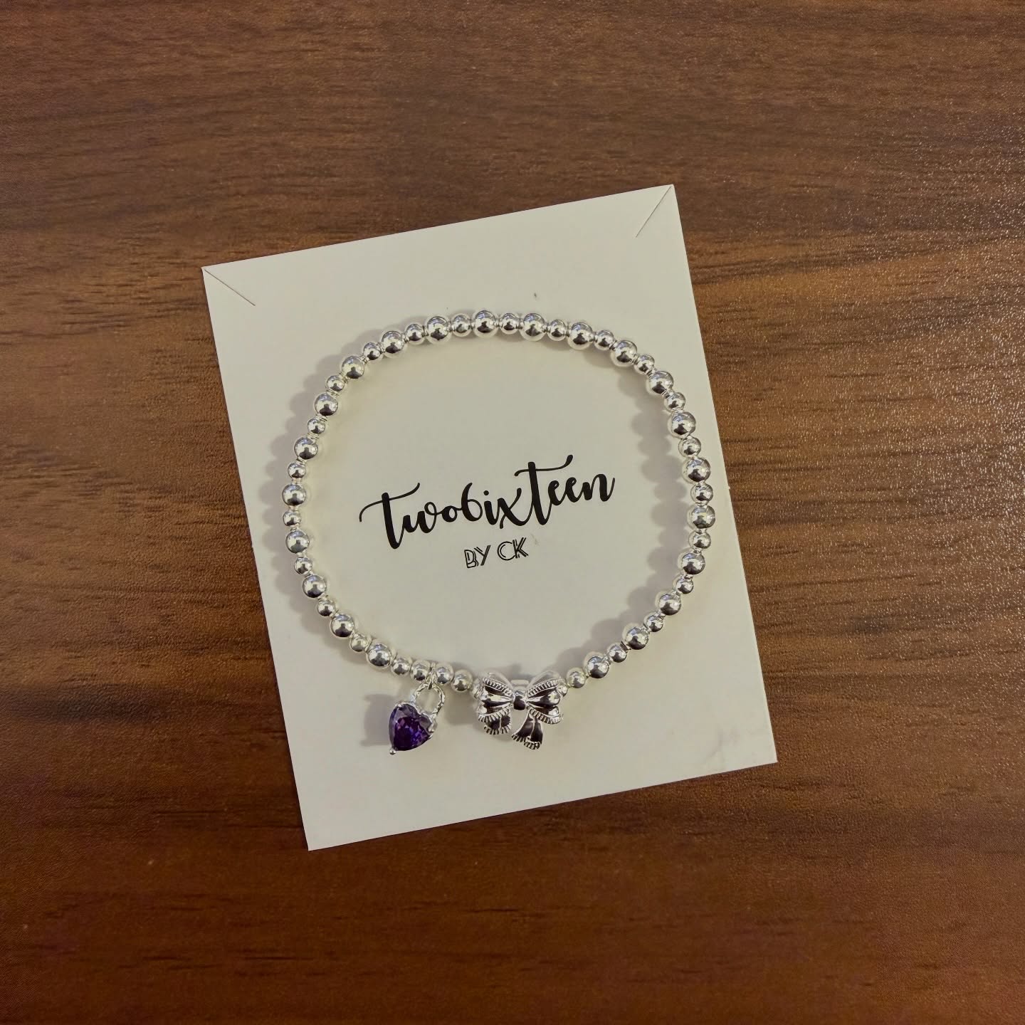 APB001 圓珠彈性手鏈拼蝴蝶結心型石