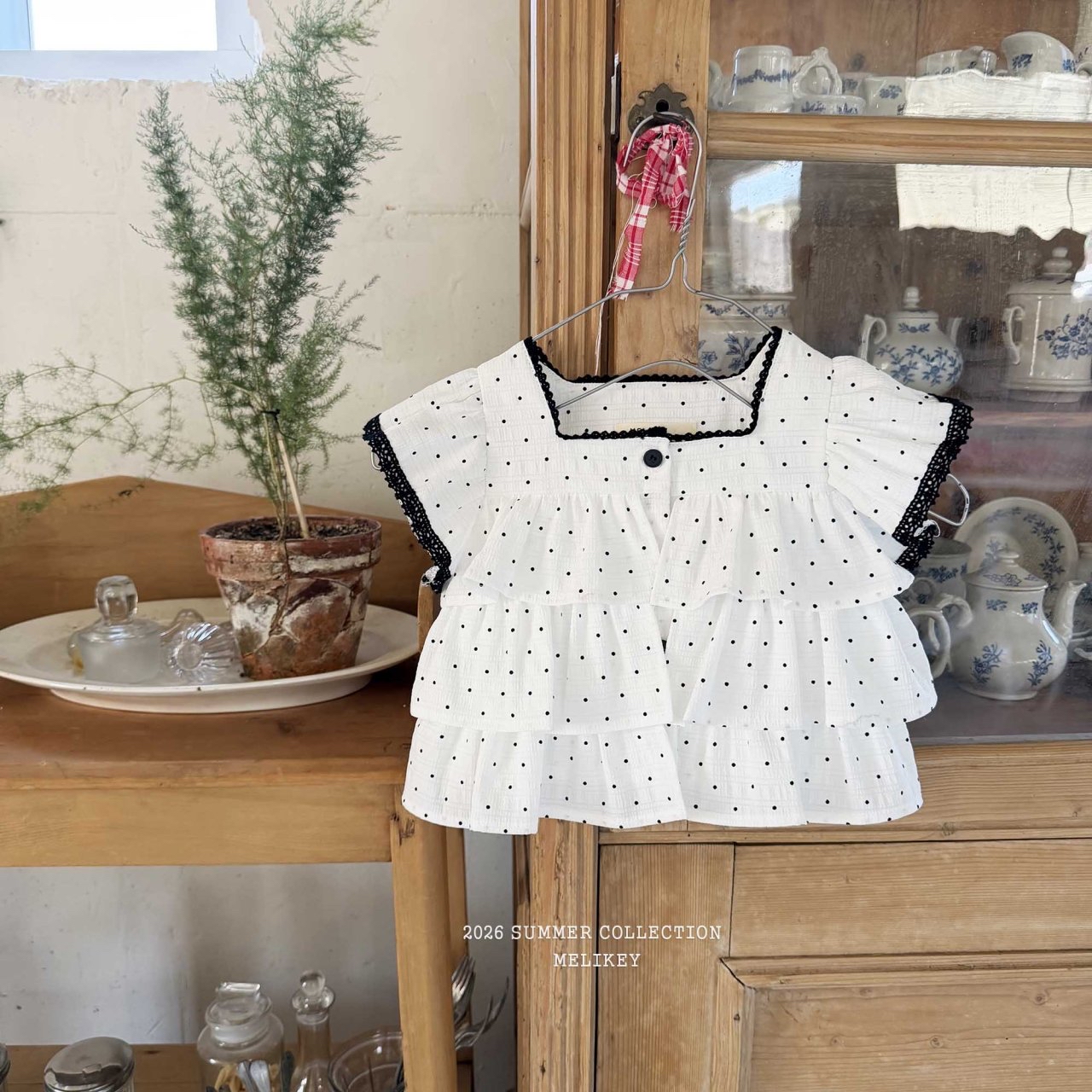 Dot Tiered Sleeveless Blouse