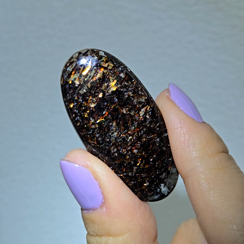 Astrophyllite cabochon with red, golden, bronze inclusions - AST25 