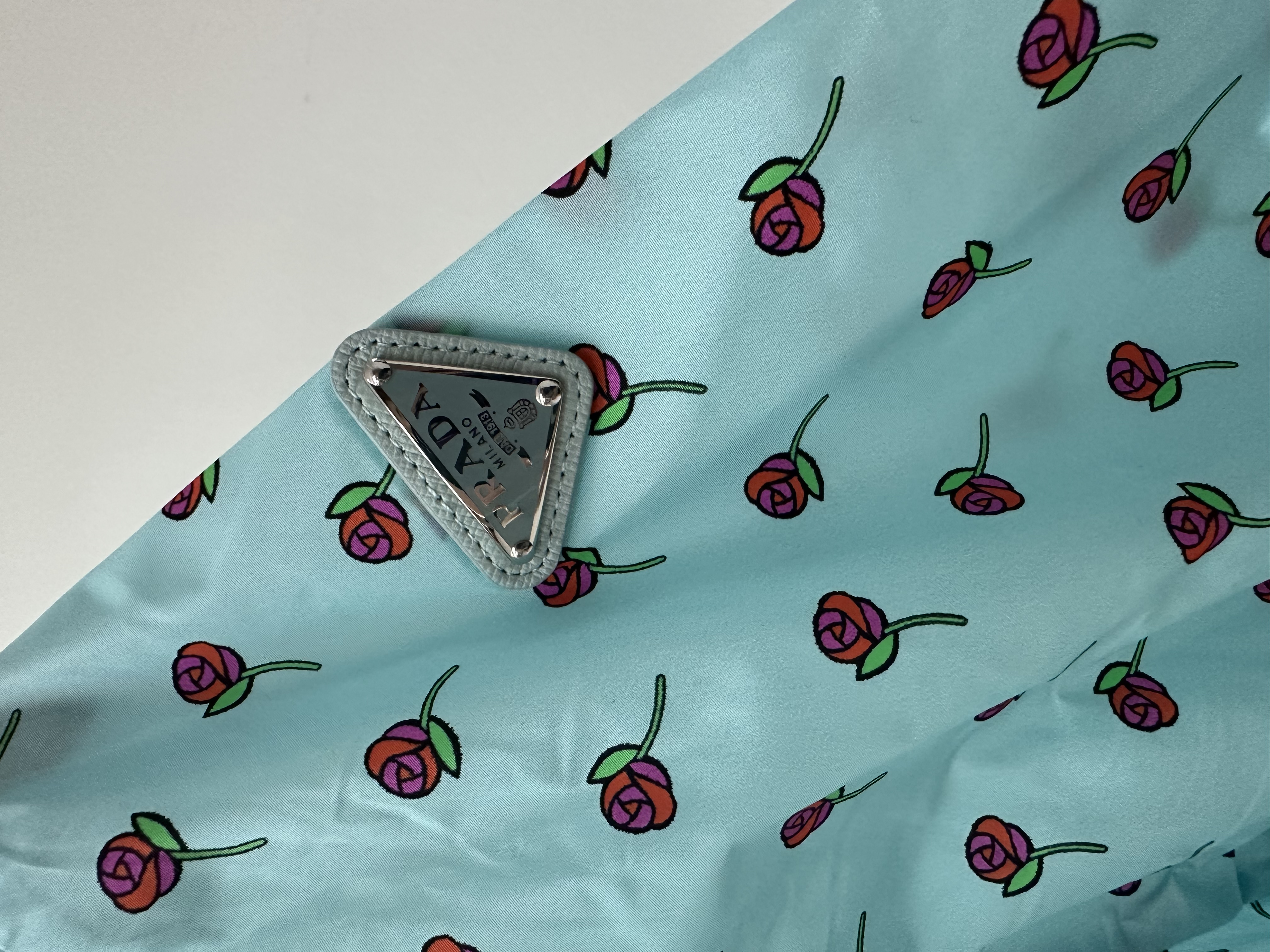 Pre-owned Prada light blue rose print rain jacket / Product Code: 26050804