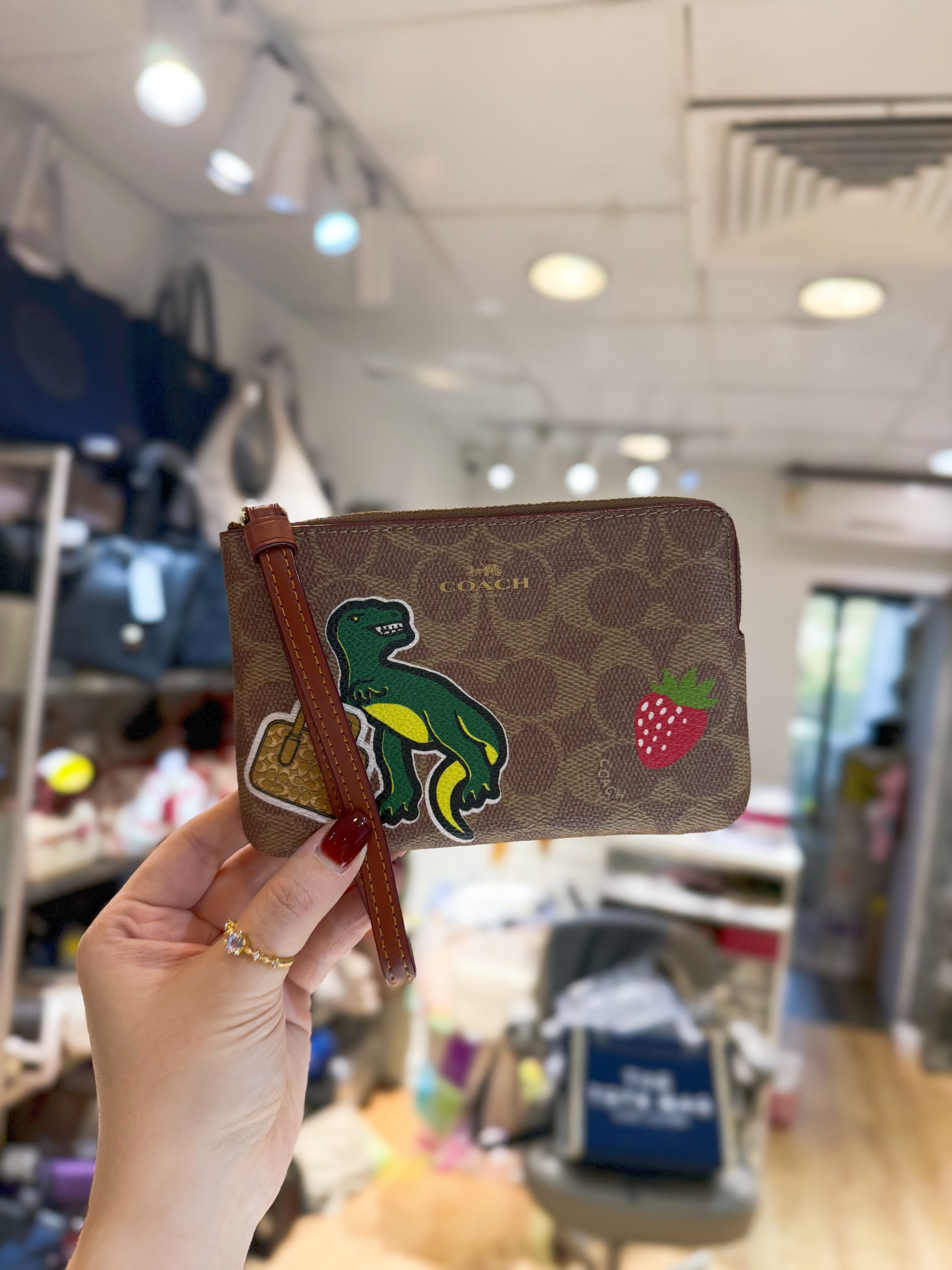 Coach wristlet logo/m/dinosaur