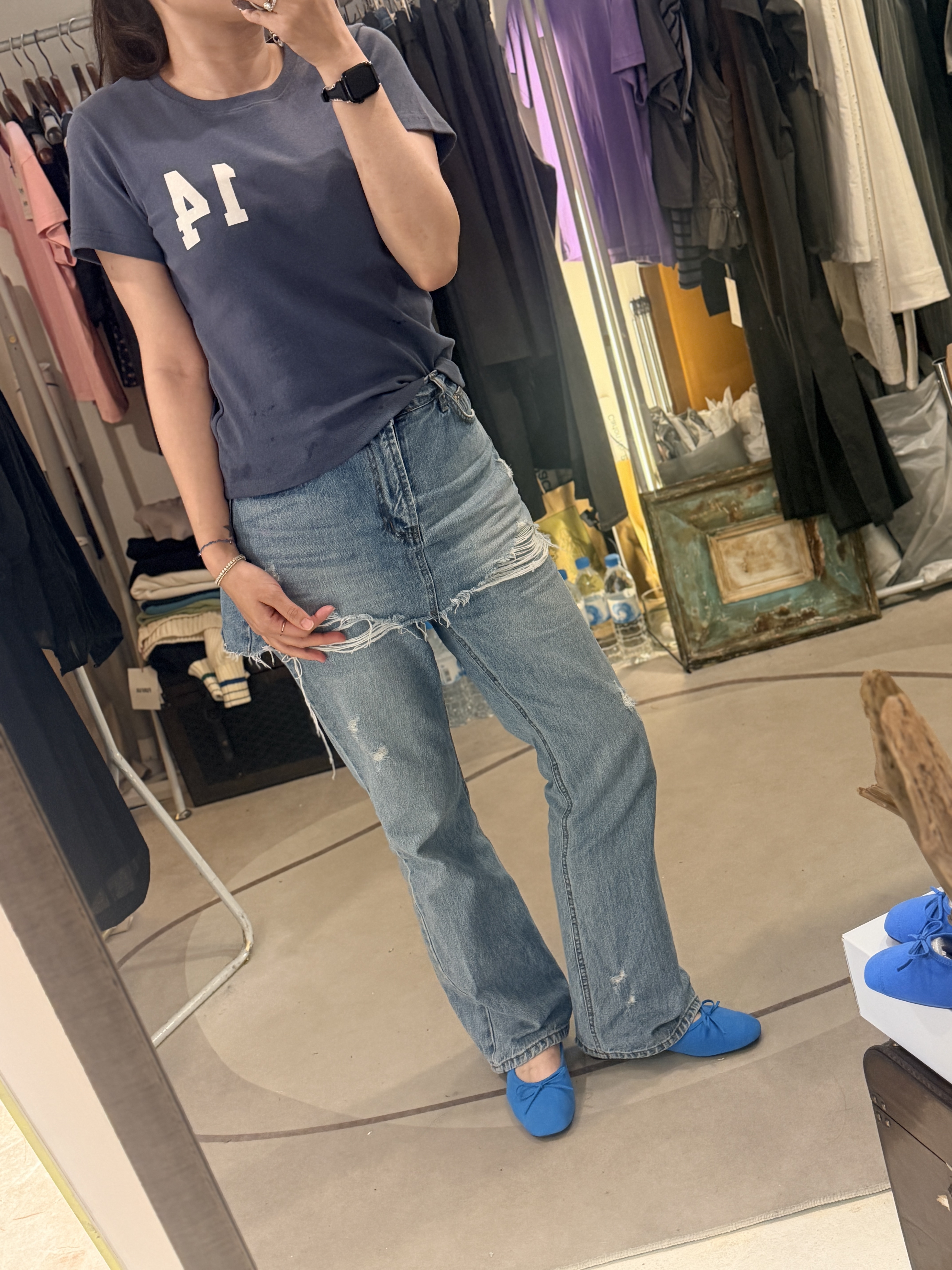 Denim skirt over jeans