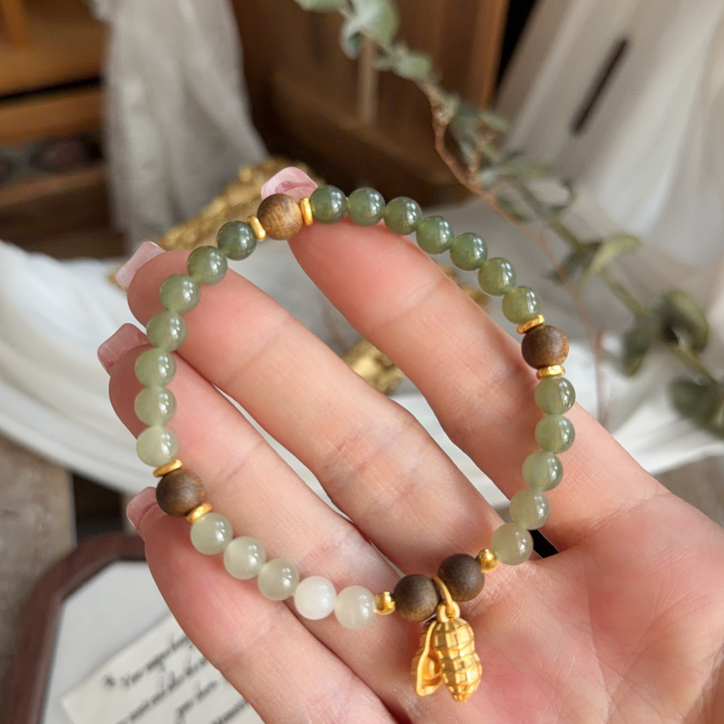 6mm和田玉+沉香襯999足金花生手串