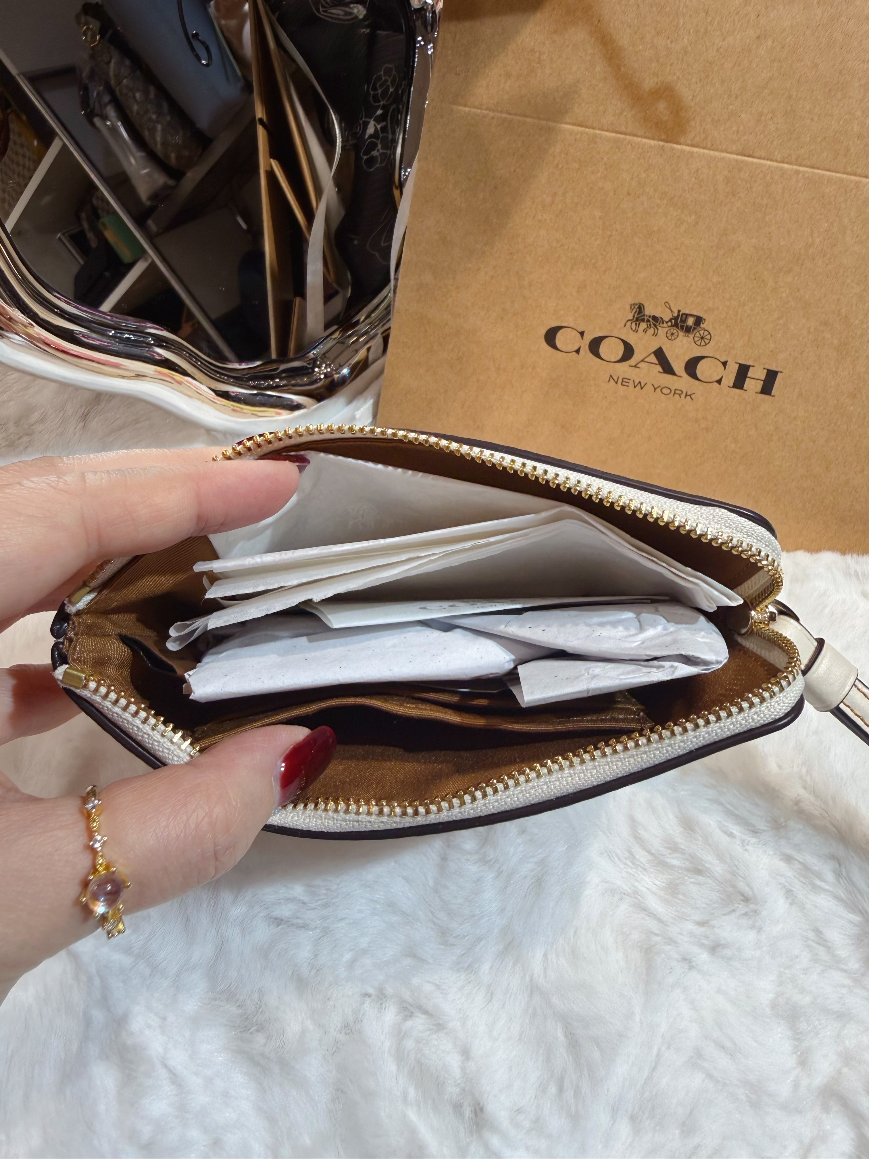 Coach wristlet Lfloral/W