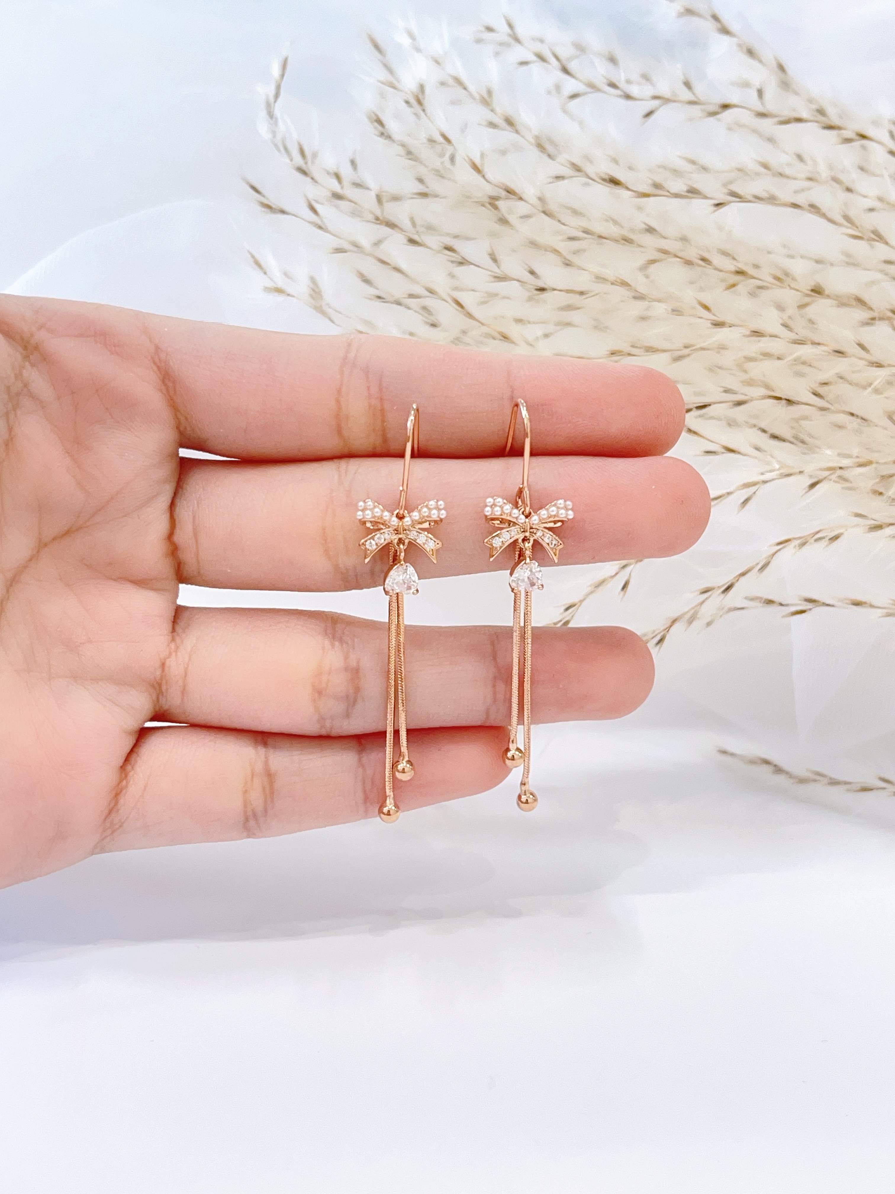 玫瑰金蝴蝶结双流苏耳环