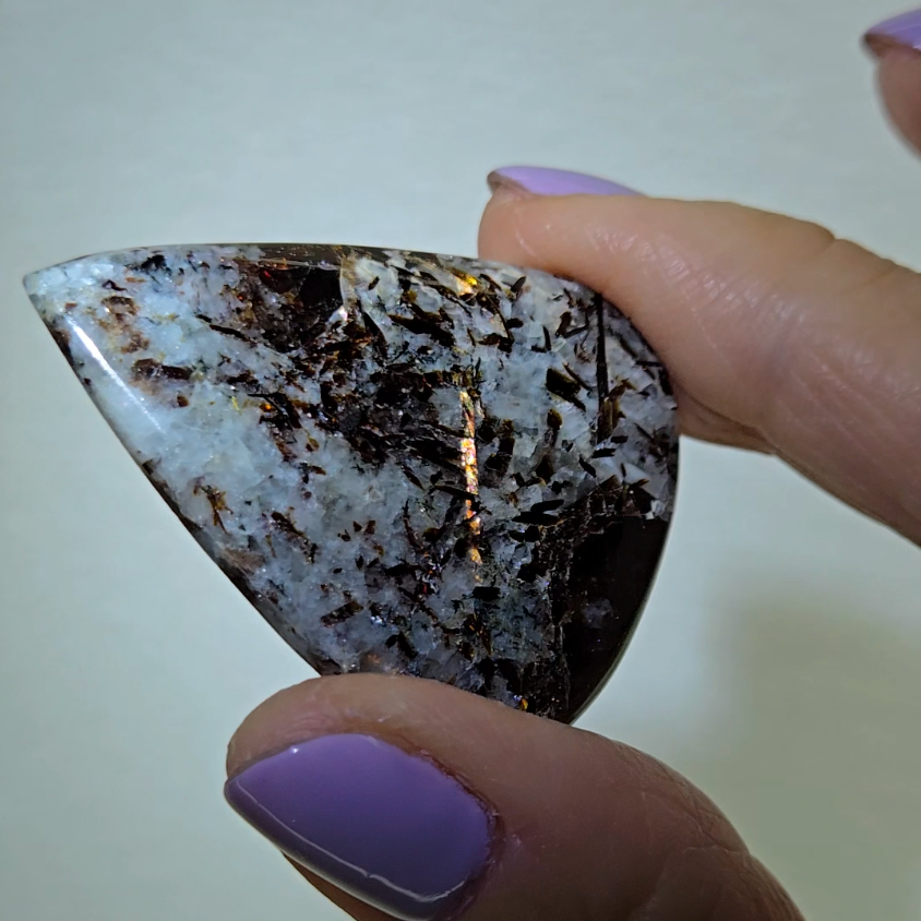 Astrophyllite cabochon with flashy golden flakes - AST21