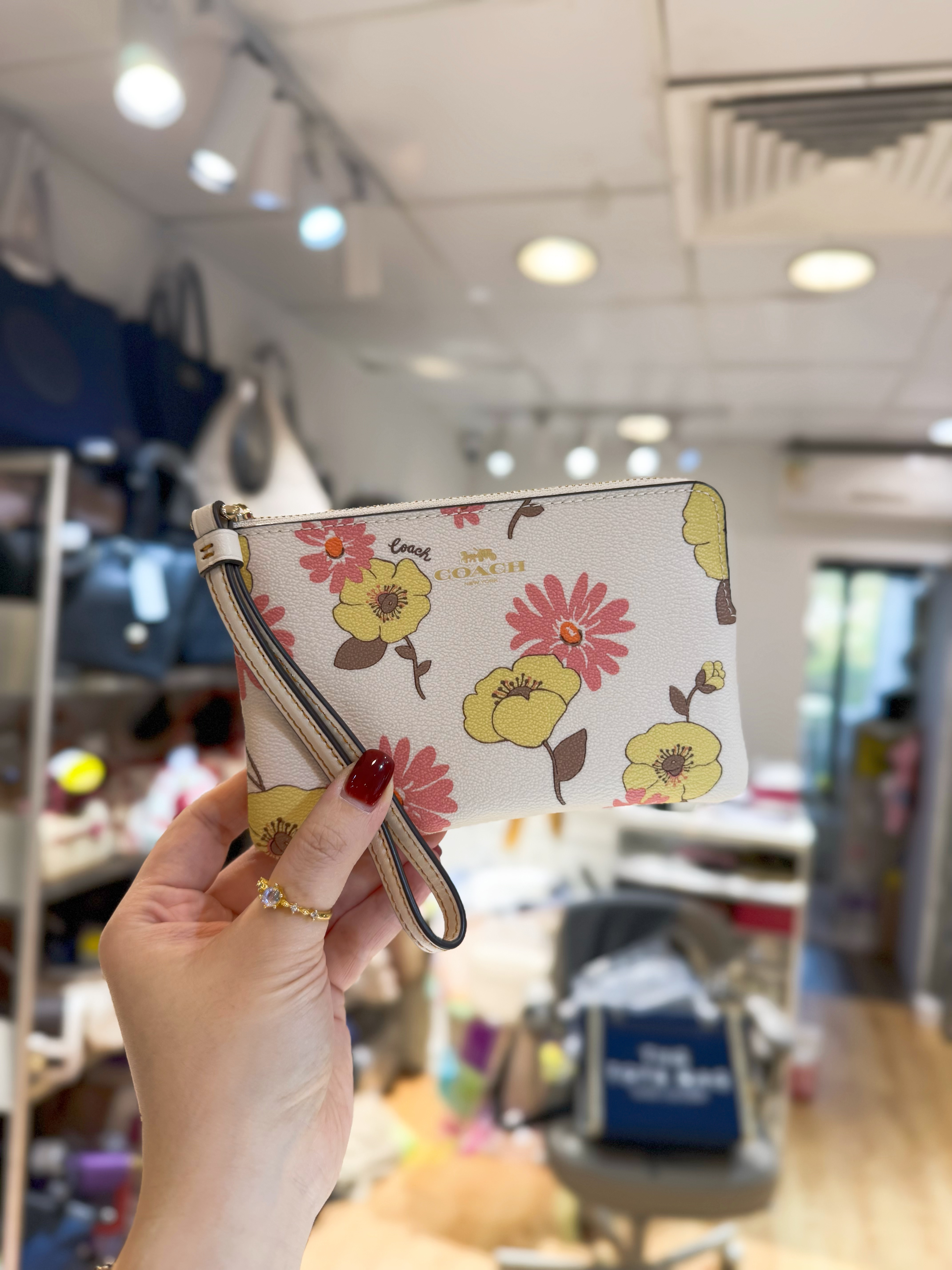 Coach wristlet Lfloral/W